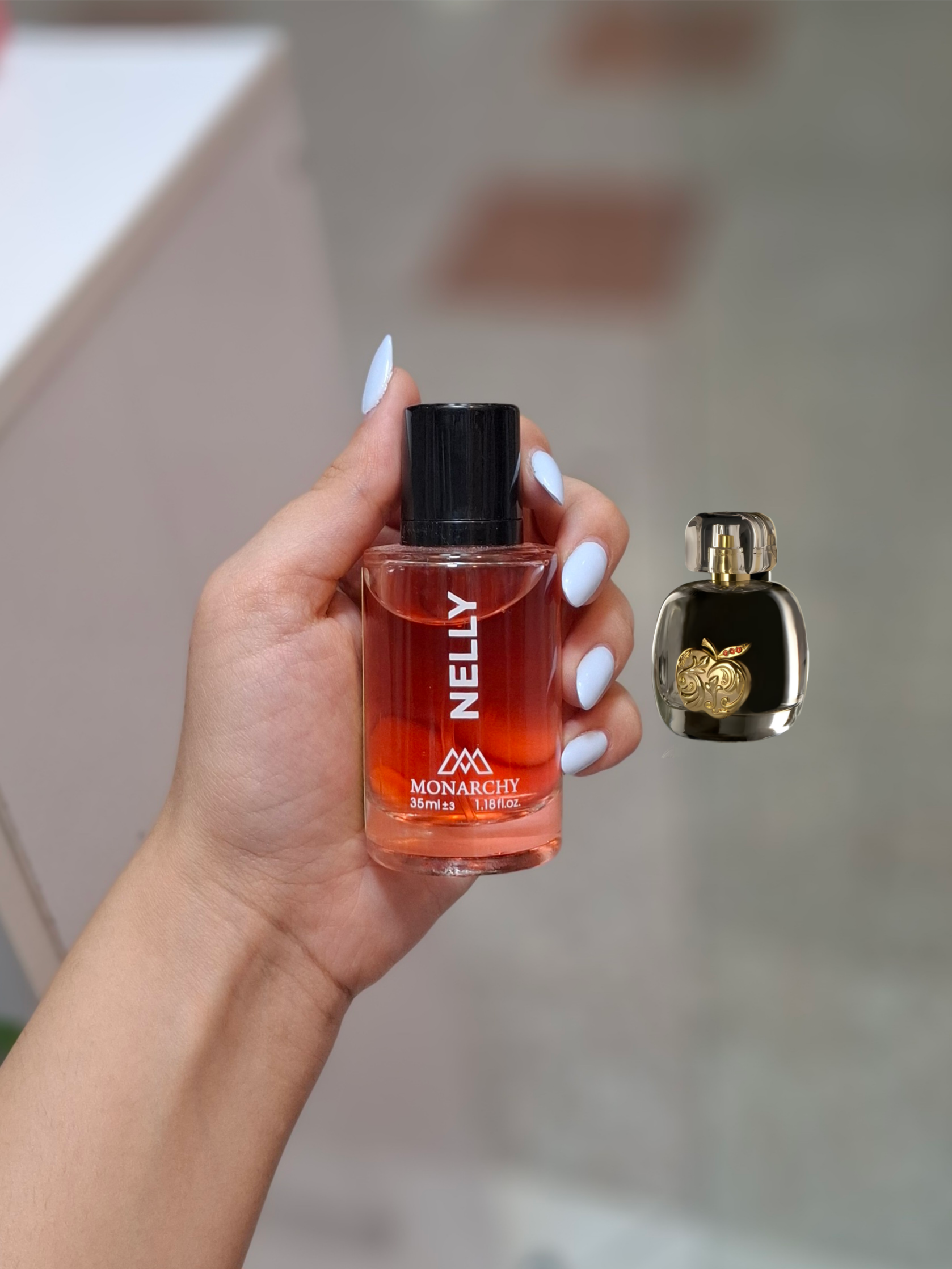 عطر جیبی زنانه بایلندو مدل نلی با رایحه گرم  حجم 35 میلی‌لیتر